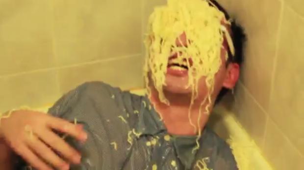 Template meme Filthy Frank with ramen noodles on his face.