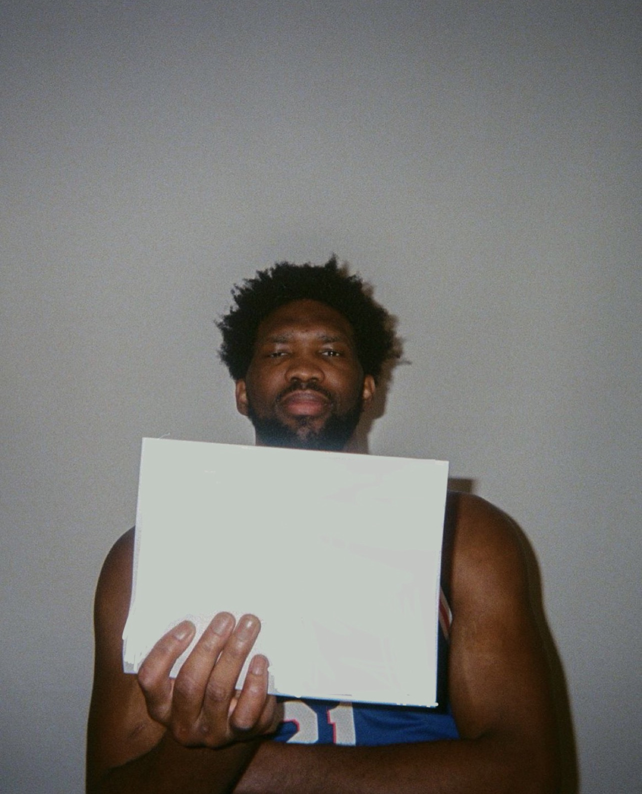Template meme Joel Embiid Holding Sign
