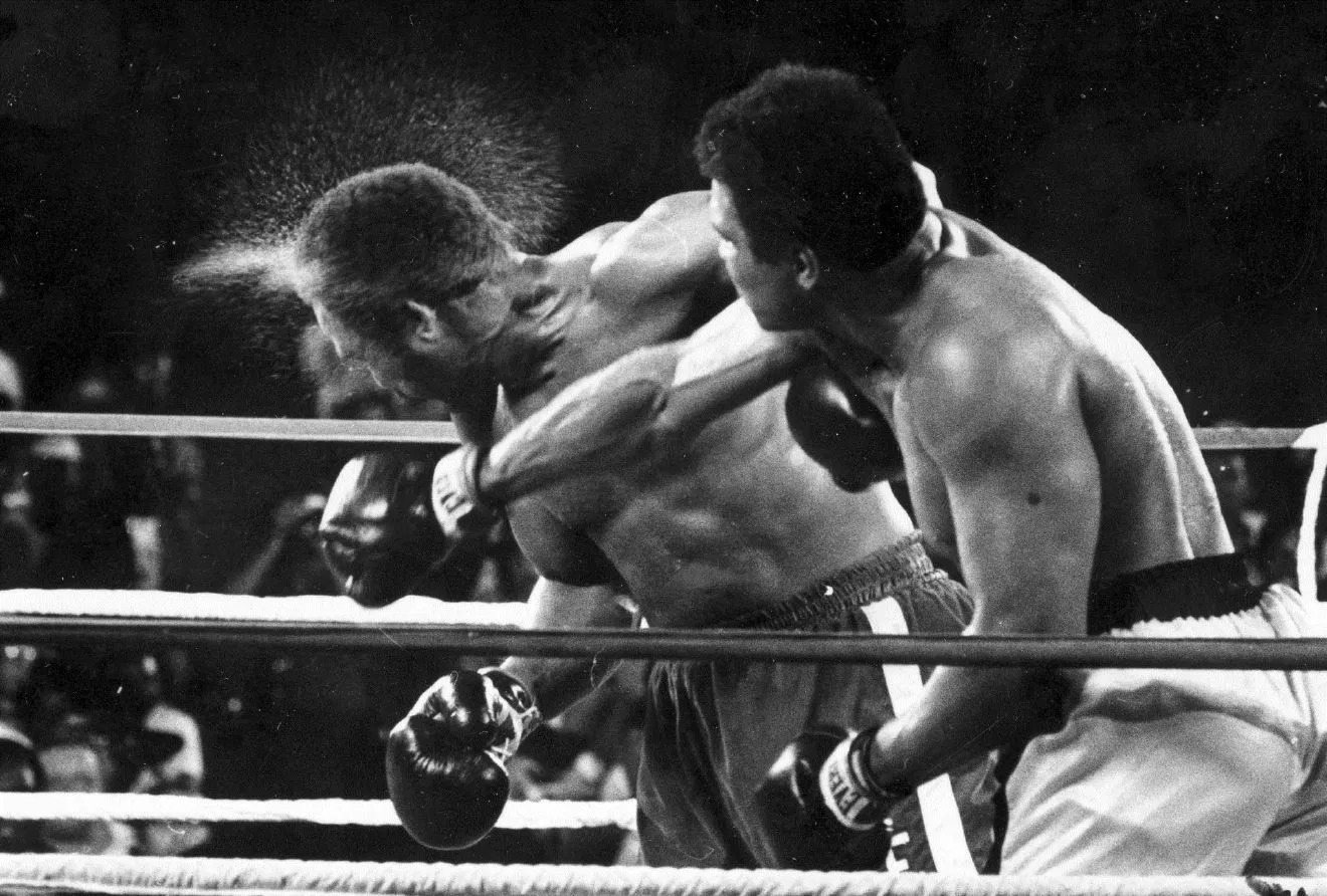 Template meme Muhammad Ali punches someone.
